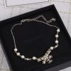 Gold Pearl and Bow Pendant Necklace