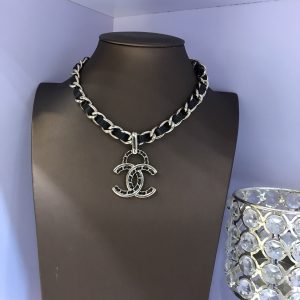 Black leather and gold pendant necklace